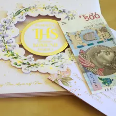 Ile chrzestny daje na Komunię? Kwoty, prezenty, savoir-vivre